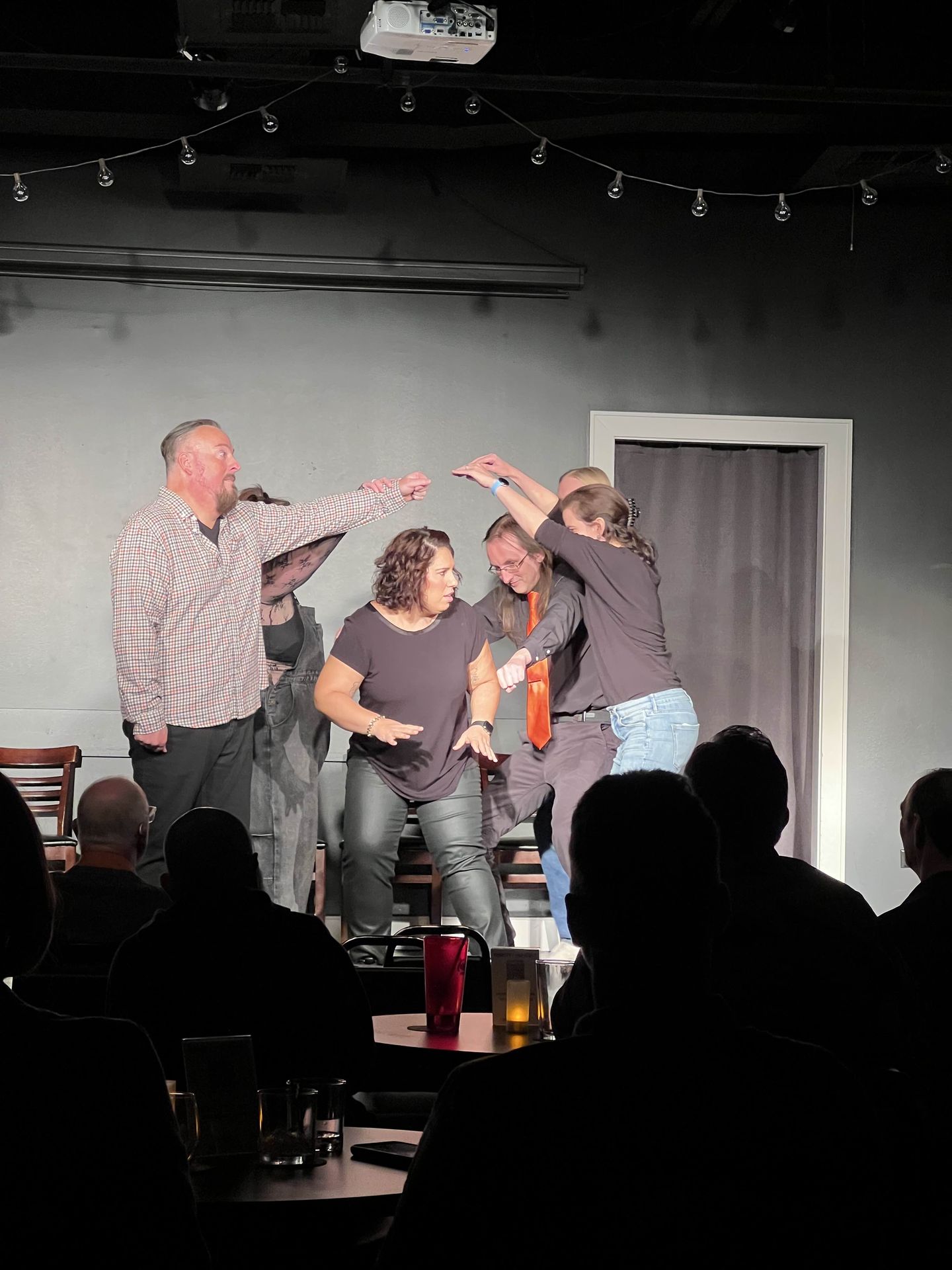 group of people in a theater play